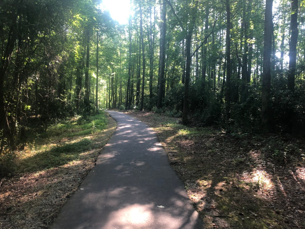A shaded portion of the White Deer Loop trail at White Deer Park in Garner, N.C.